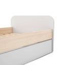 Cama nido juvenil ESTEBAN blanca con detalles en madera natural y cajón inferior extraíble para almacenamiento o segunda cama