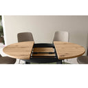 Mesa de comedor redonda extensible DONATA con patas metálicas en X y diseño moderno