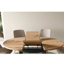 Mesa de comedor redonda extensible con patas metálicas en X modelo DONATA de diseño moderno y funcional