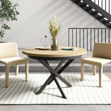 Mesa de comedor redonda extensible con patas metálicas en X modelo DONATA, fabricada en España.