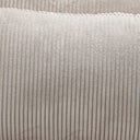 Butaca cama de tela beige con textura acanalada y costuras verticales marcadas en el tapizado.
