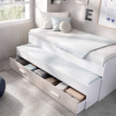 Cama Compacta juvenil blanca de melamina con cama supletoria y cajón inferior para almacenamiento, diseño funcional y moderno.