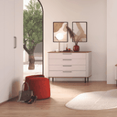 Cómoda dormitorio CAPRI de 4 cajones con diseño moderno y patas negras.