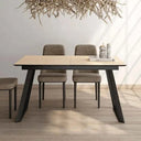 Mesa comedor extensible ROMINA con acabado efecto piedra y estructura metálica negra