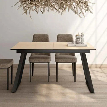 Mesa comedor extensible ROMINA con acabado efecto piedra y estructura metálica negra