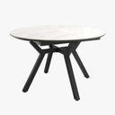 Mesa comedor redonda extensible con acabado efecto piedra y patas metálicas negras.