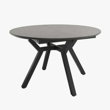 Mesa comedor redonda extensible Giovianna con acabado piedra y patas metálicas negras
