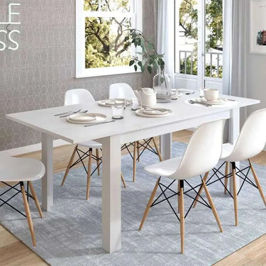 Mesa de comedor extensible Allegra con patas en L y acabado melamina de alta calidad.