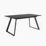 Mesa comedor extensible ROMINA PIEDRA con acabado efecto piedra y patas metálicas negras.