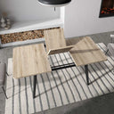 Mesa de comedor extensible AGNESE con patas trapecio y apertura semi-automática.