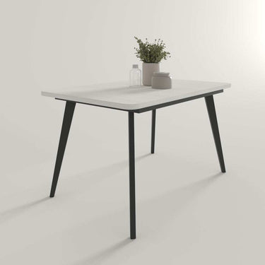 Mesa comedor extensible SERENA con esquinas redondeadas y patas metálicas, disponible en varios colores.