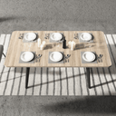 Mesa de comedor extensible LUNA con patas metálicas en X y acabados en varios colores.