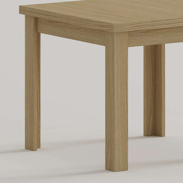 Mesa cuadrada tipo libro extensible ALESSIA con pata en L y tablero laminado natural.