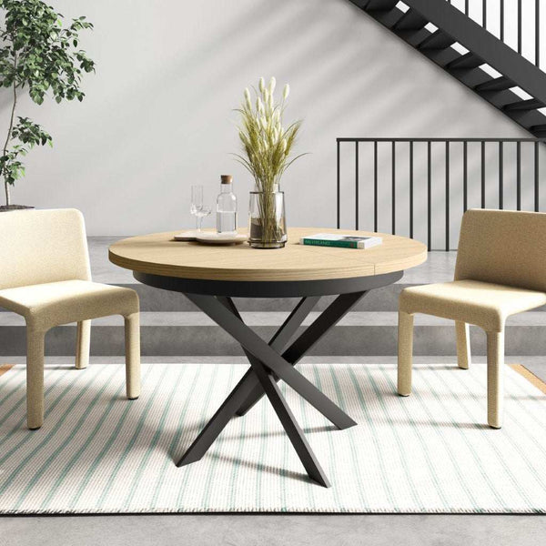 Mesa de comedor redonda extensible con patas metálicas en X modelo DONATA, fabricada en España.