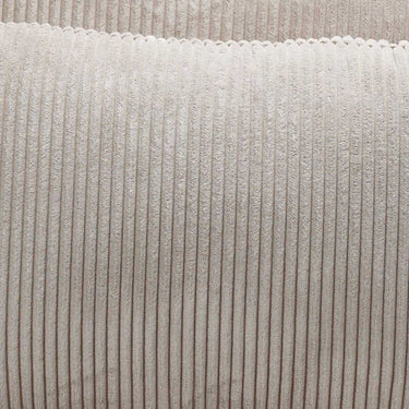 Butaca cama de tela beige con textura acanalada y costuras verticales marcadas en el tapizado.