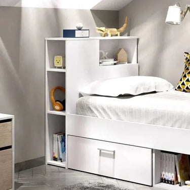 Cama Compacta juvenil en blanco con estantería lateral, cajón inferior y arcón para almacenamiento integrado y diseño reversible.