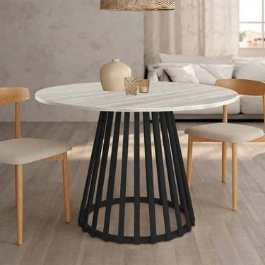Mesa de comedor redonda fija DELTA con pata central metálica y tapa biselada disponible en seis colores.