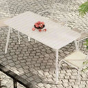 Mesa de exterior Ululono metálica minimalista en terraza