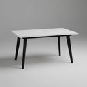 Mesa salón comedor extensible PALMIRA con diseño moderno y patas metálicas en blanco o negro, disponible en colores Artisan, Polar, Nuez y Roble Natural.