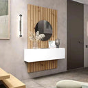 Recibidor with a white floating cabinet, light wood slatted wall panel and round dark mirror.