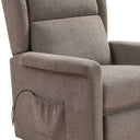 Sillón relax tapizado en tejido marrón grisáceo, con respaldo alto, brazos acolchados y bolsillo lateral.
