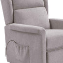Sillón relax gris de tejido texturizado, con brazos acolchados y bolsillo lateral para guardar objetos pequeños.